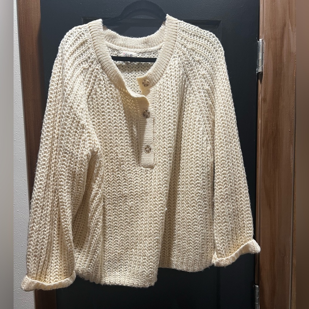 Oversize cream sweater with buttons